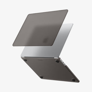 Spigen MacBook Air 13-inch Air Skin in Frost Black showing the top shell of the Frost Black case lifting away from the MacBook to illustrate the two-piece snap-on design