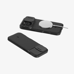 Spigen iPhone 16 Pro Case – Optik Armor MagFit in Black – rear views with a magnetic charger attached